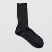 A pair of charcoal gray ribbed socks made from a blend of wool and cashmere, displayed against a white background.