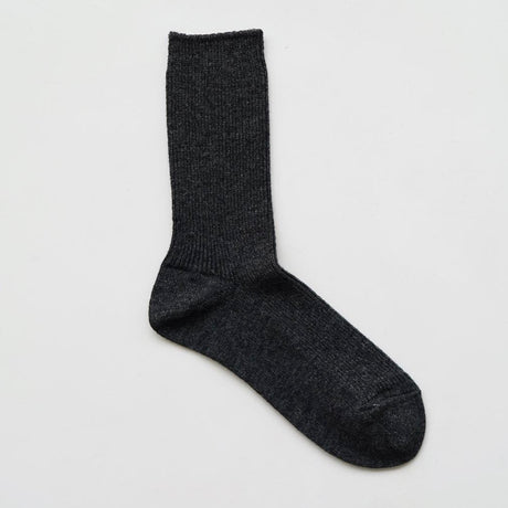 A pair of charcoal gray ribbed socks made from a blend of wool and cashmere, displayed against a white background.